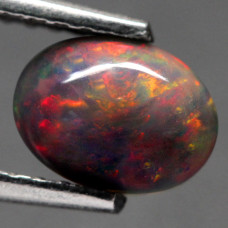 Натуральный темный благородный Опал овал 6.6х5.0мм 0.48ct