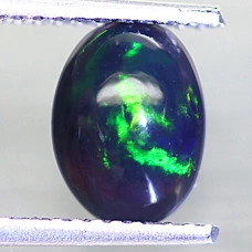 Натуральний чорний благородний Опал овал 8.2х6.1мм 0.72ct