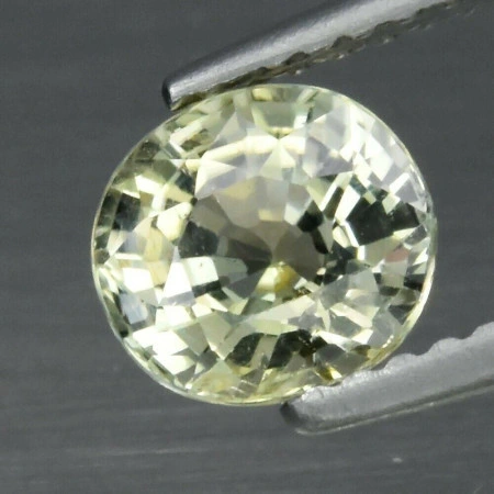 Натуральный желтый Турмалин овал 6.4x5.9мм 1.05ct