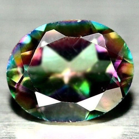 Натуральний містичний Кварц овал 10.0x8.1мм 2.38ct Натуральний містичний Кварц овал 10.0x8.1мм 2.38ct