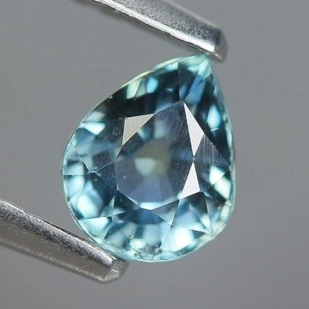 Натуральный не гретый Сапфир со сменой цвета груша 5.4x4.4мм 0.61ct