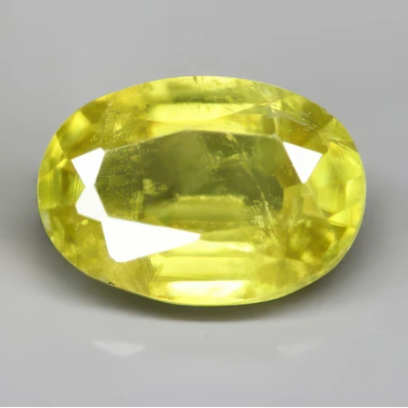 Натуральный Сфен овал 6.3х4.5мм 0.63ct